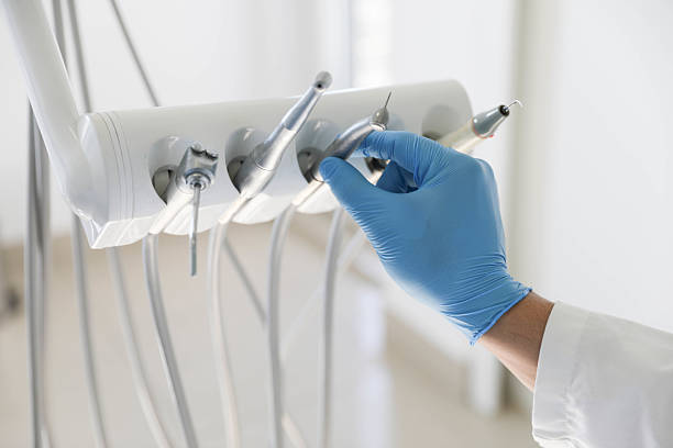 Professional Tooth Extraction technician working in Highlands, TX